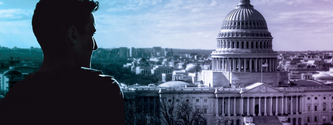 Photo of the U.S. Capitol building with a contemplative person silhouetted in front.